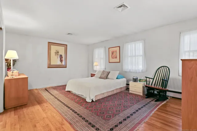 a bedroom with a bed and a couch