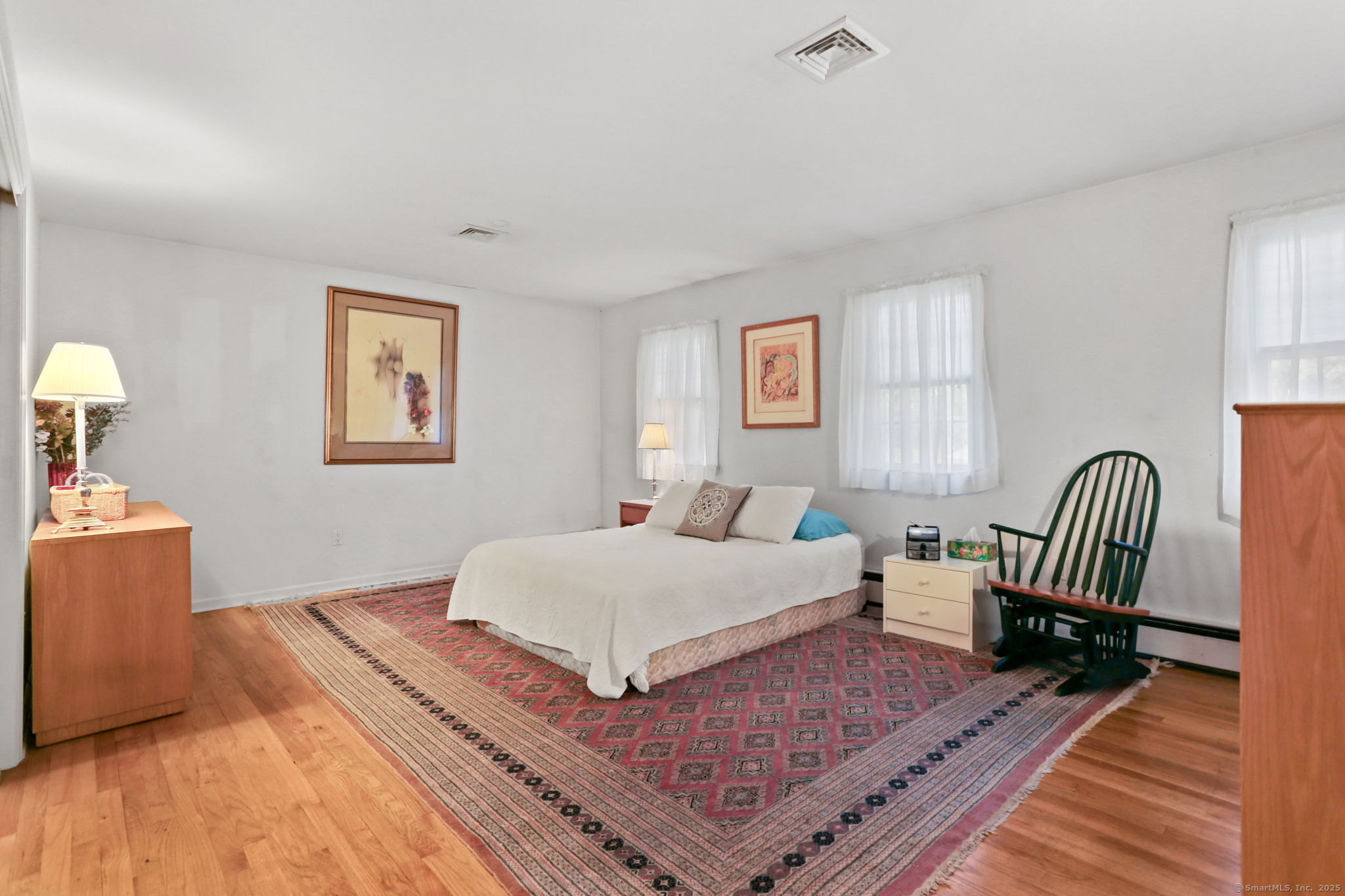 41 Calvin Road Wilton, CT 06897 - Photo 22 of 34 a bedroom with a bed and a couch