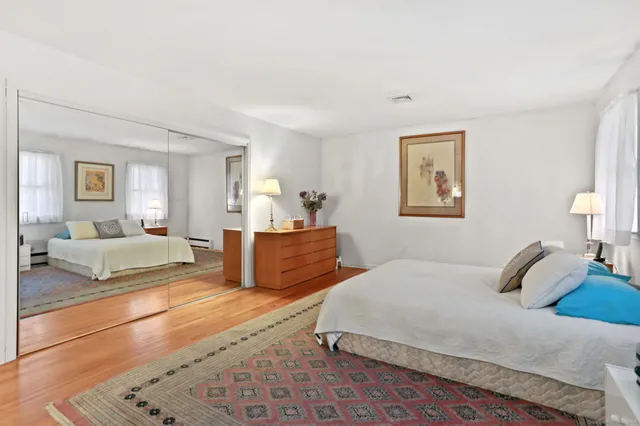 a bedroom with a large bed and a couch