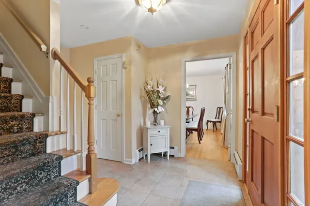 a view of an entryway with furniture and a livingroom