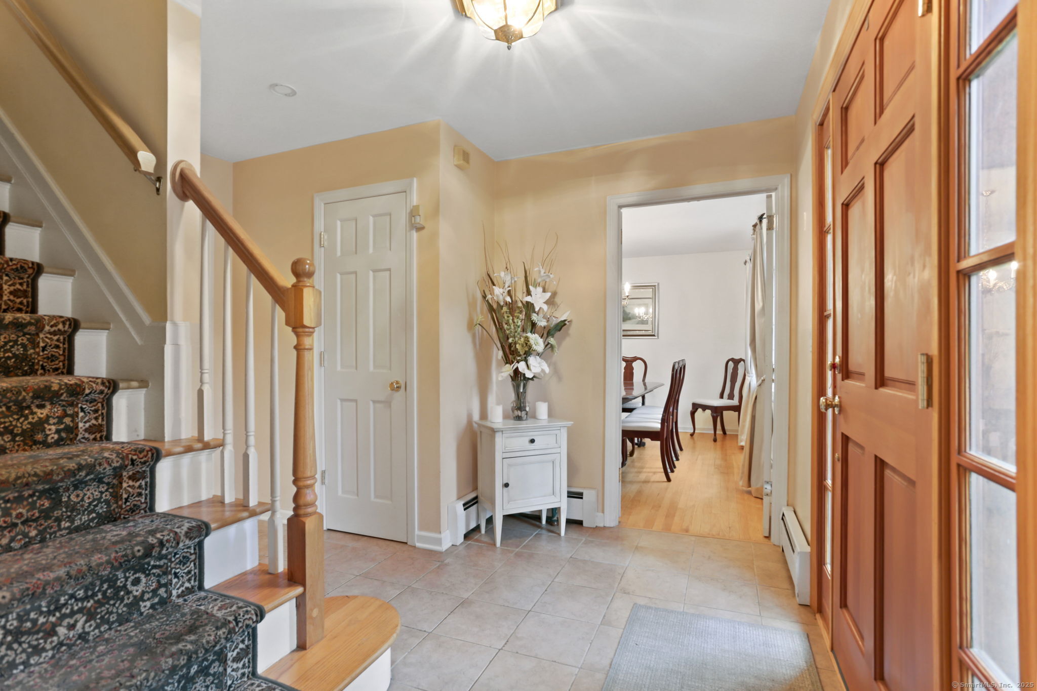 41 Calvin Road Wilton, CT 06897 - Photo 4 of 34 a view of an entryway with furniture and a livingroom
