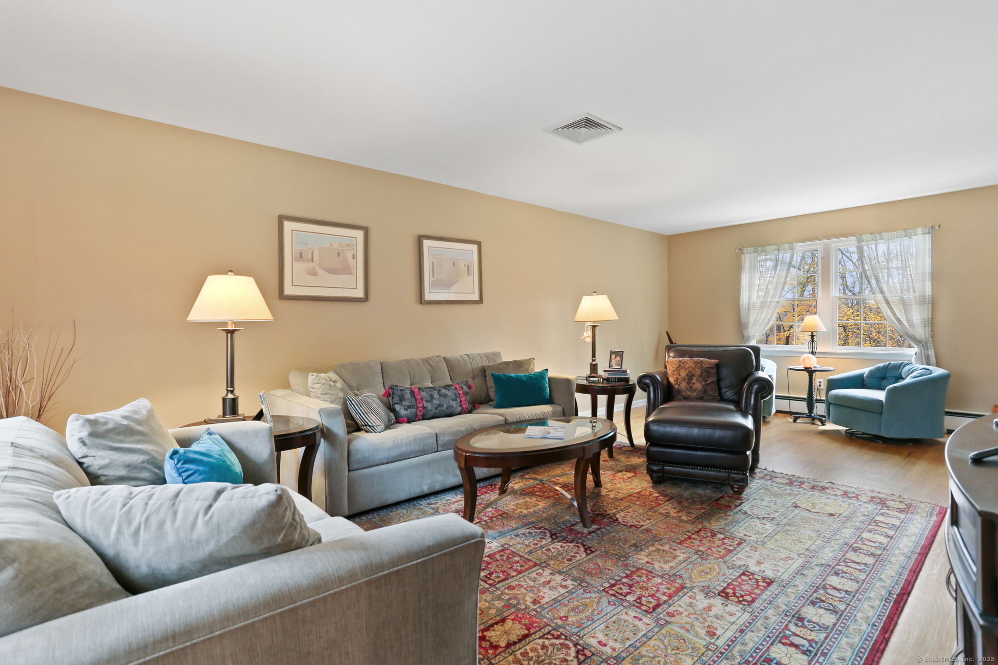 41 Calvin Road Wilton, CT 06897 - Photo 6 of 34 a living room with furniture and a large window