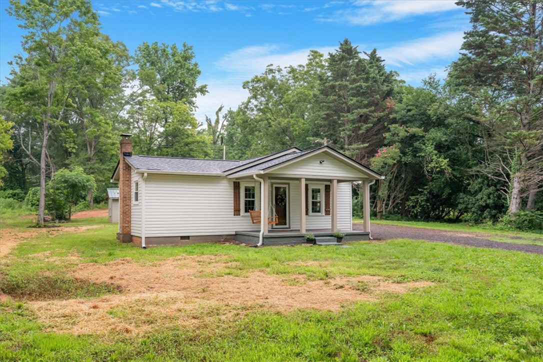 174 Holliday Road Six Mile, SC 29682 - Photo 4 of 49 A charming single-story residence with a welcoming porch and a spacious lot