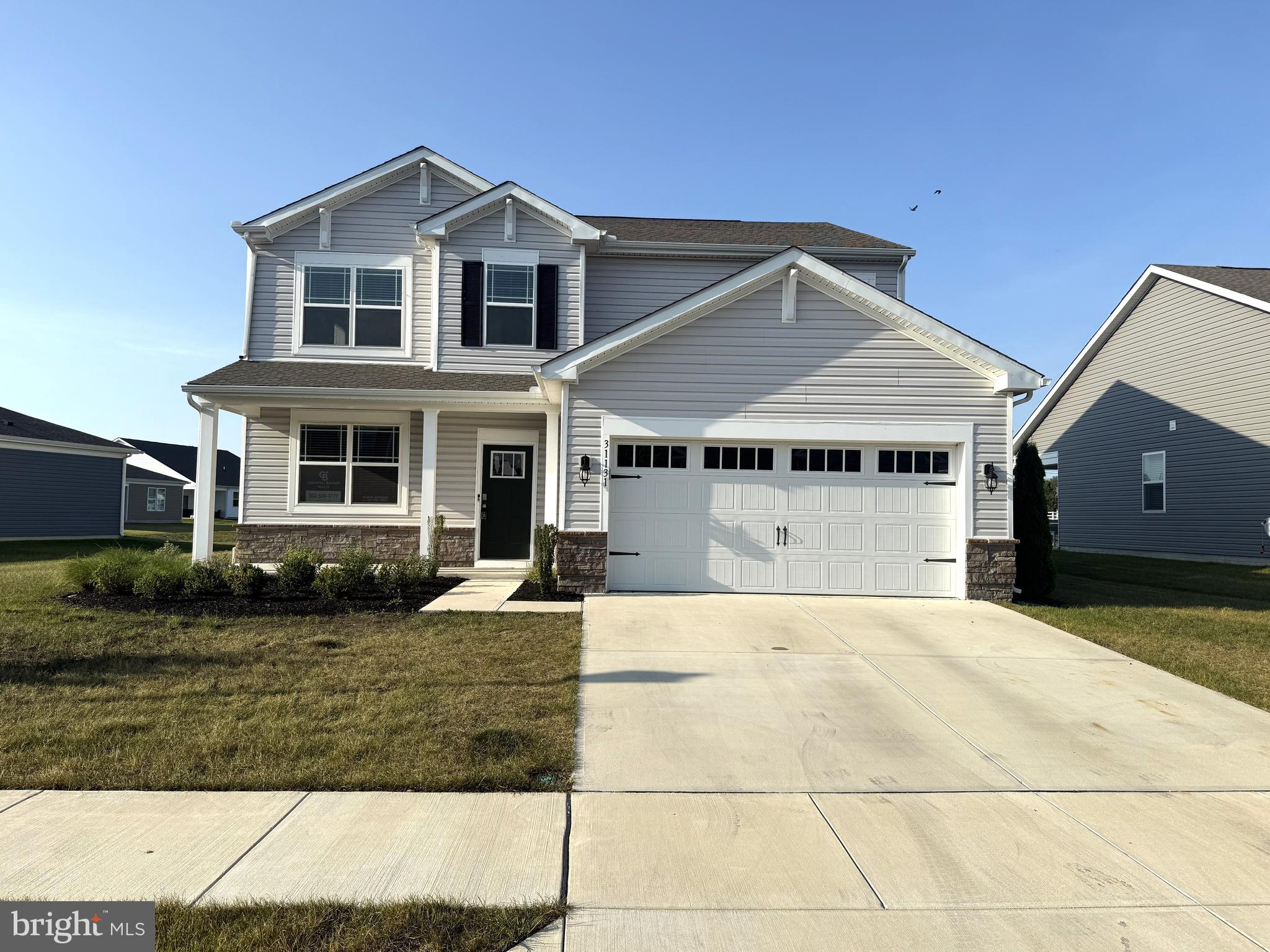 31131 Tigress Road Lewes, DE 19958 - Photo 2 of 45 a front view of a house with a yard