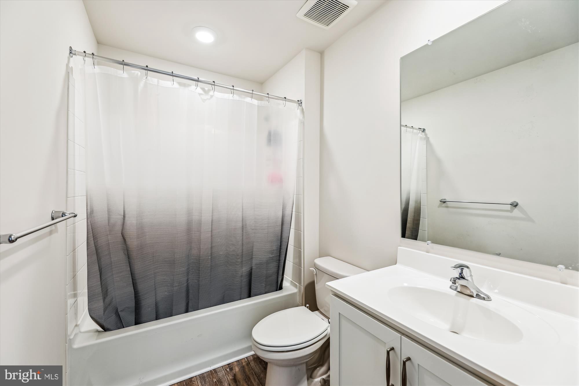 31131 Tigress Road Lewes, DE 19958 - Photo 28 of 45 a bathroom with a sink toilet and shower