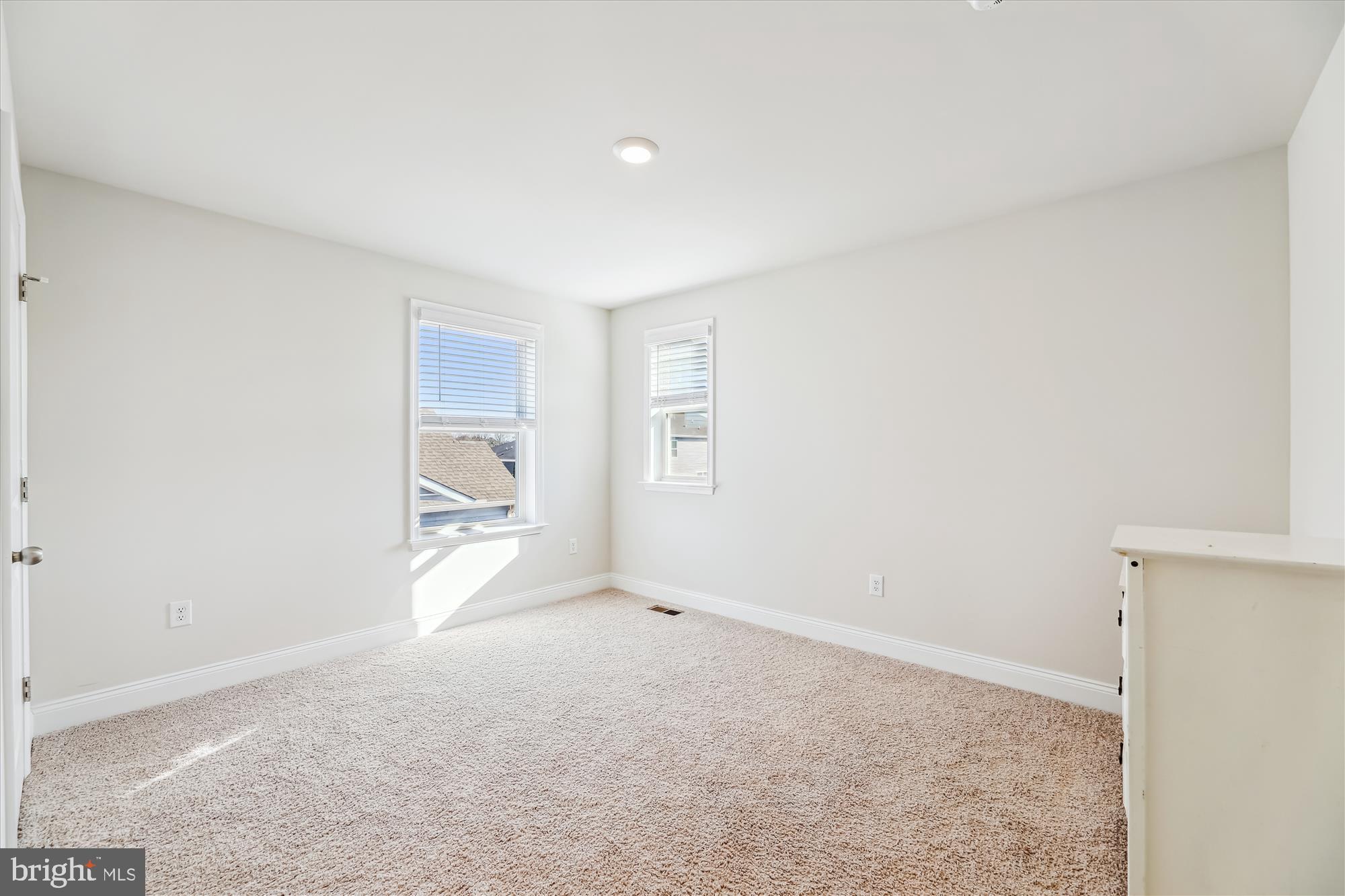 31131 Tigress Road Lewes, DE 19958 - Photo 30 of 45 a view of empty room with wooden floor
