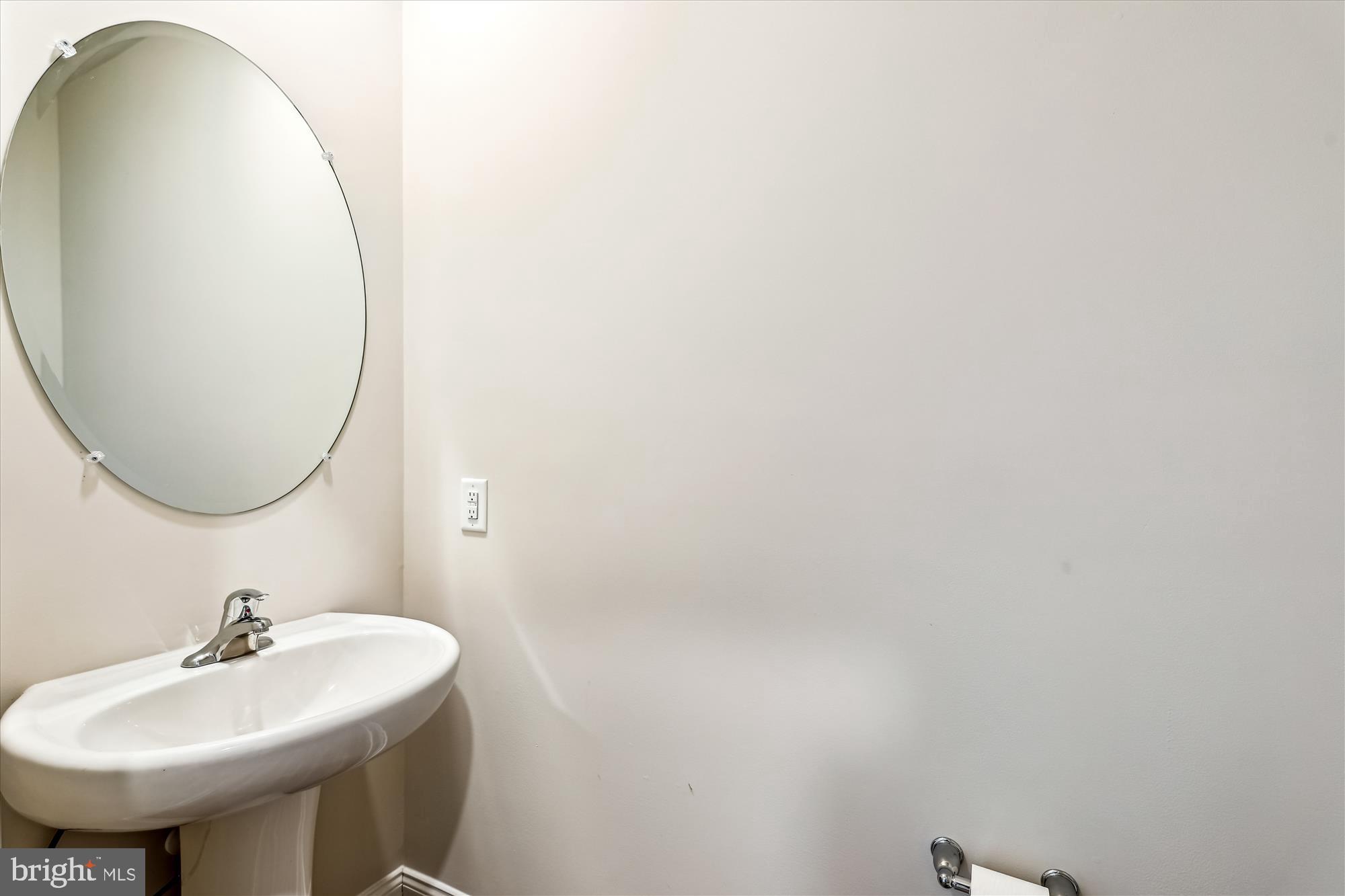 31131 Tigress Road Lewes, DE 19958 - Photo 32 of 45 a bathroom with a sink and a mirror