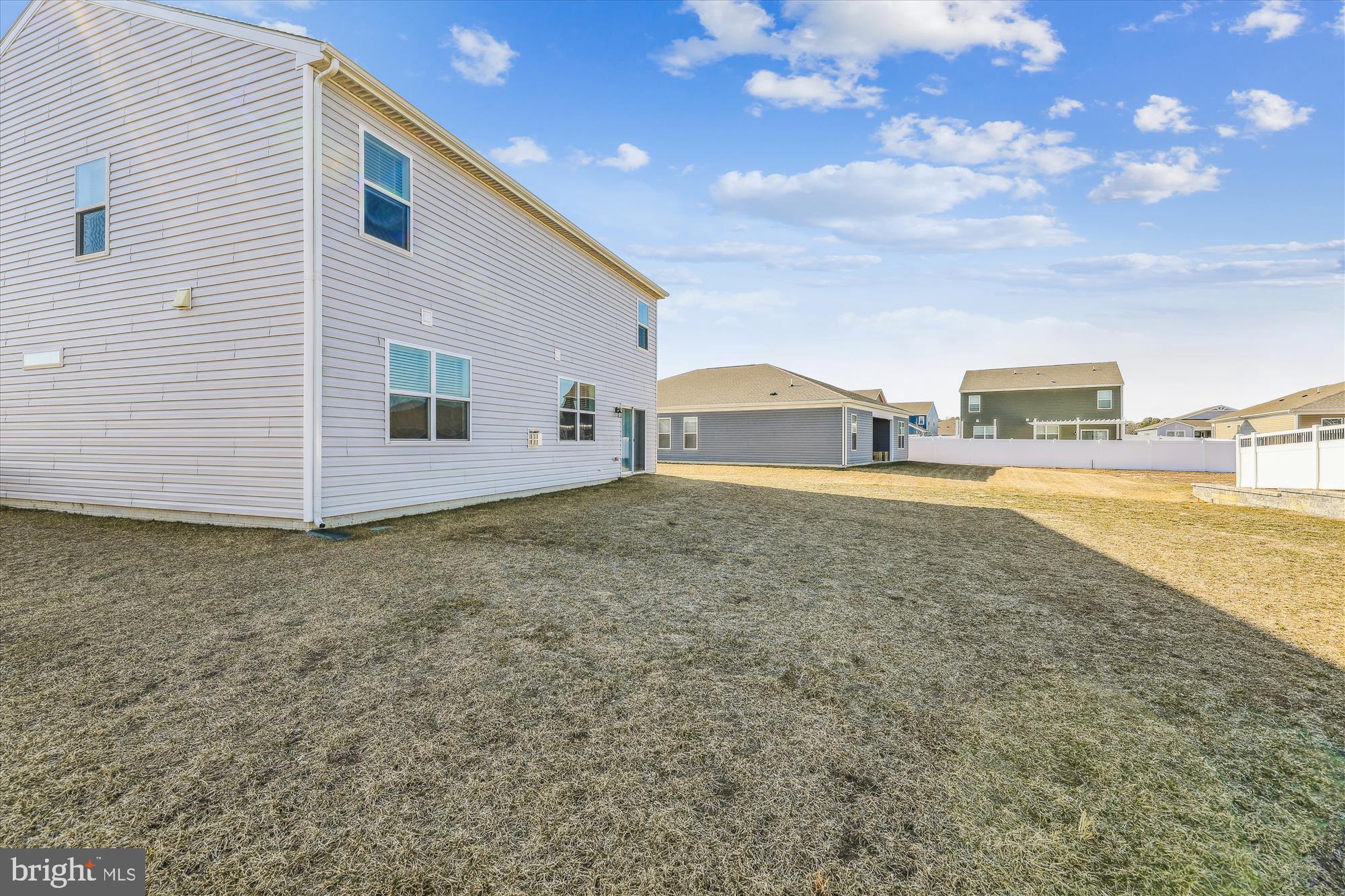 31131 Tigress Road Lewes, DE 19958 - Photo 35 of 45 a view of an house with backyard space