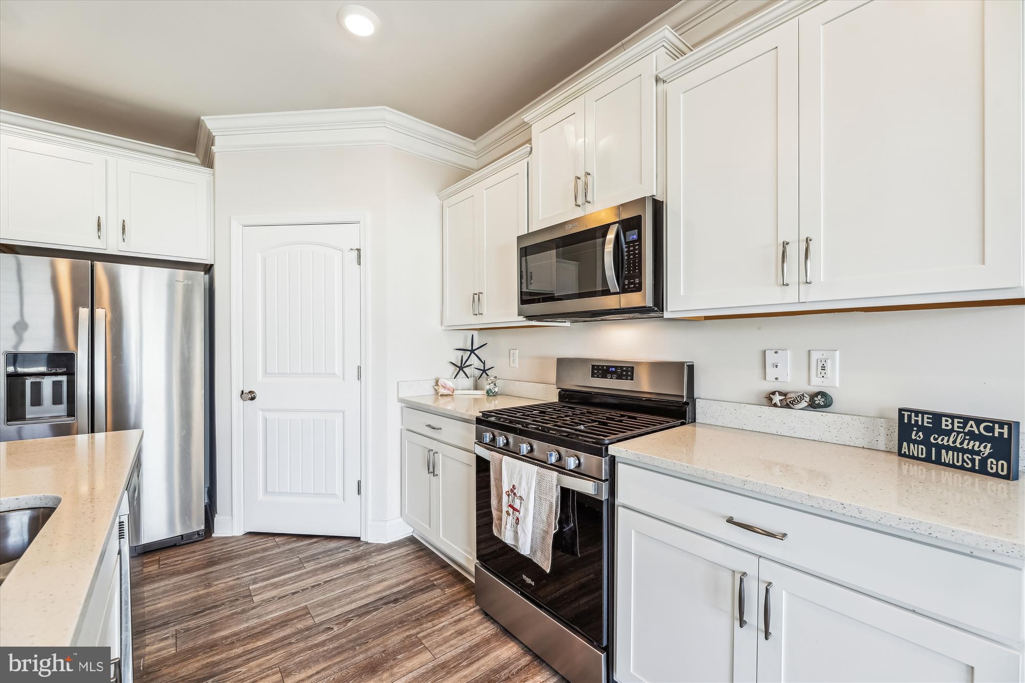 31131 Tigress Road Lewes, DE 19958 - Photo 8 of 45 a kitchen with appliances a sink and cabinets