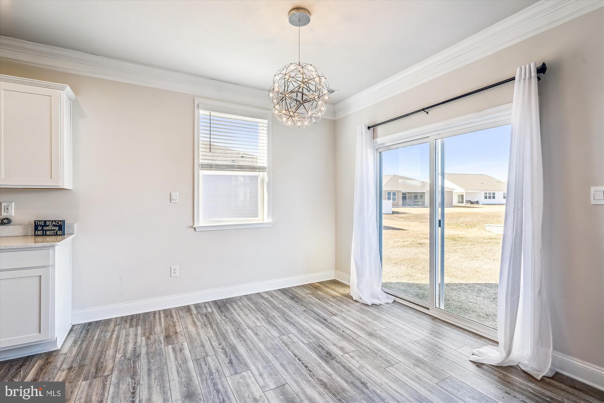 31131 Tigress Road Lewes, DE 19958 - Photo 10 of 45 a view of empty room with wooden floor and fan