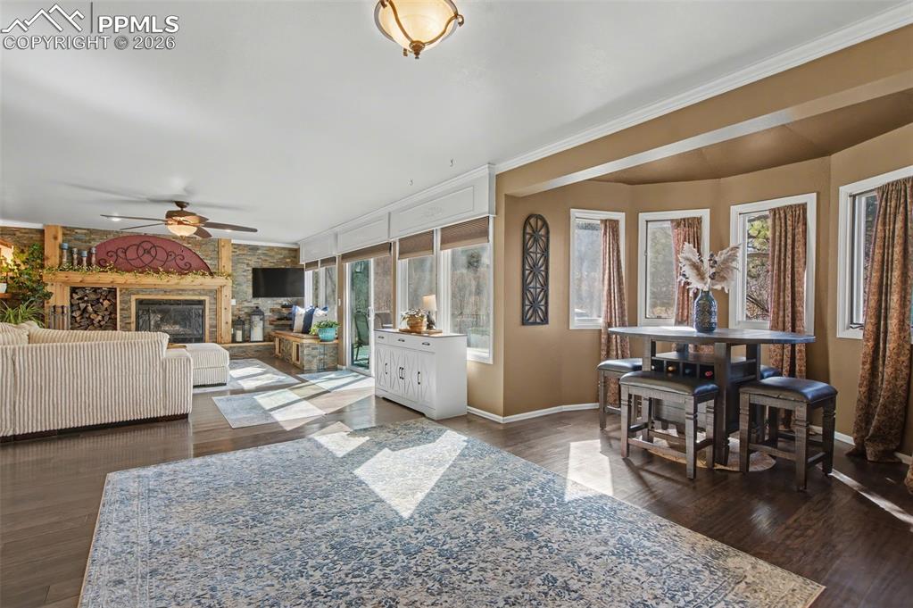 1375 Blueberry Hills Road Monument, CO 80132 - Photo 17 of 50 a living room with furniture and large windows