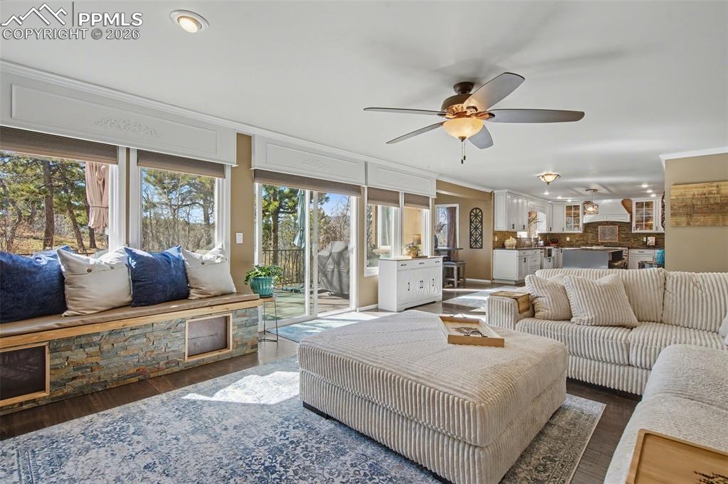 1375 Blueberry Hills Road Monument, CO 80132 - Photo 20 of 50 a living room with furniture and a large window