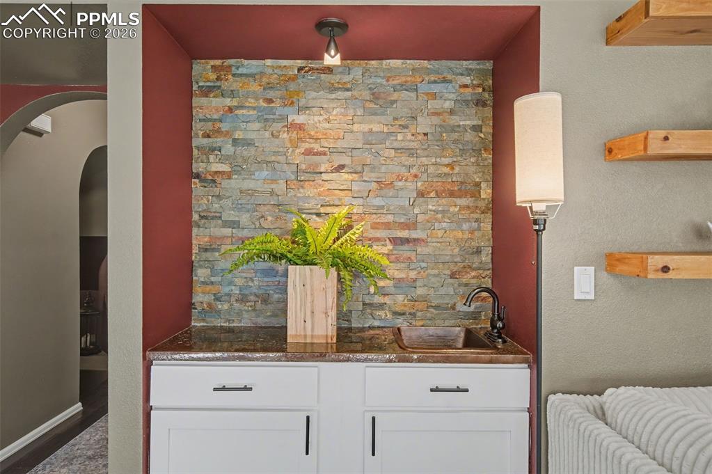 1375 Blueberry Hills Road Monument, CO 80132 - Photo 21 of 50 a bathroom with a sink and a mirror