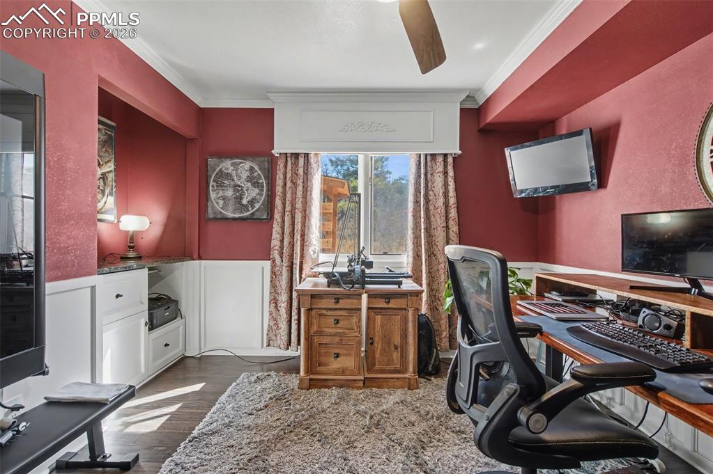 1375 Blueberry Hills Road Monument, CO 80132 - Photo 22 of 50 a view of a workspace with furniture and a window