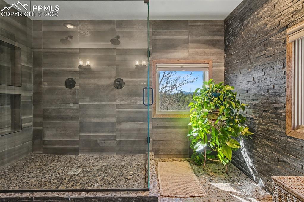 1375 Blueberry Hills Road Monument, CO 80132 - Photo 30 of 50 a bathroom with a shower