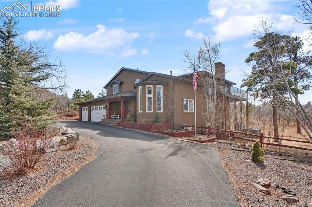 1375 Blueberry Hills Road Monument, CO 80132 - Photo 3 of 50 a front view of a house with a yard