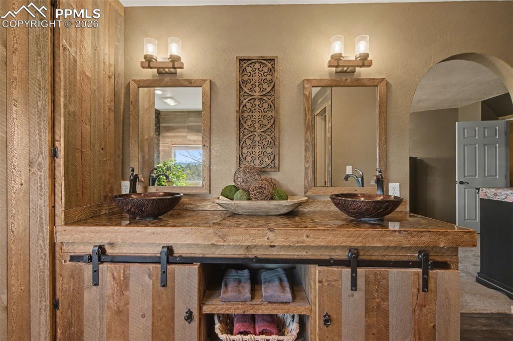 1375 Blueberry Hills Road Monument, CO 80132 - Photo 31 of 50 a view of a sink and mirror