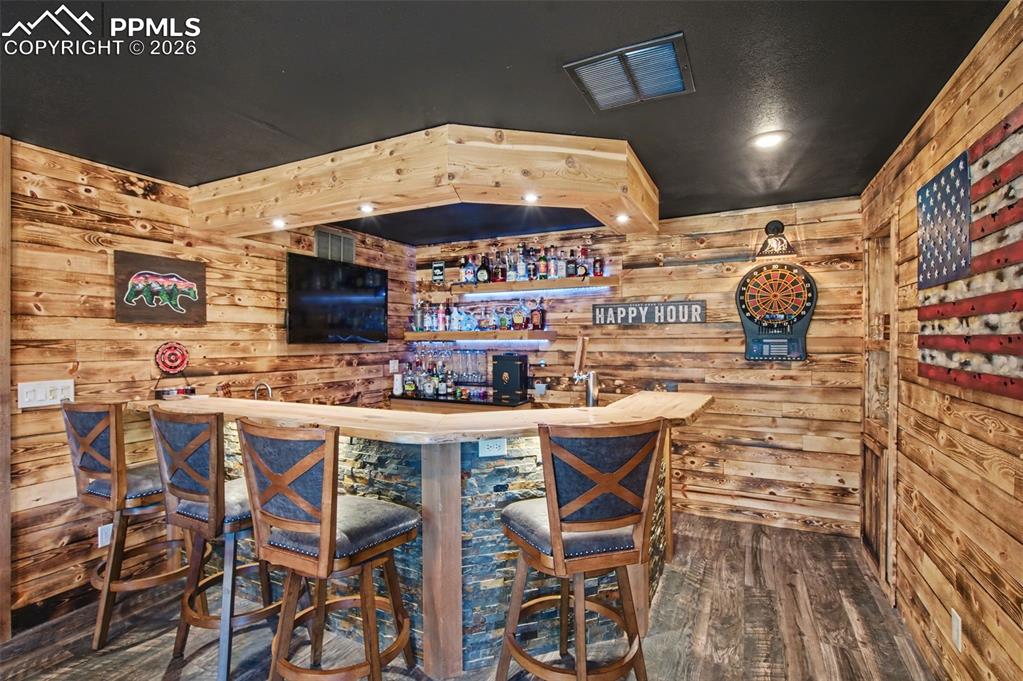 1375 Blueberry Hills Road Monument, CO 80132 - Photo 44 of 50 a open kitchen with stainless steel appliances kitchen island granite countertop a table and chairs in it