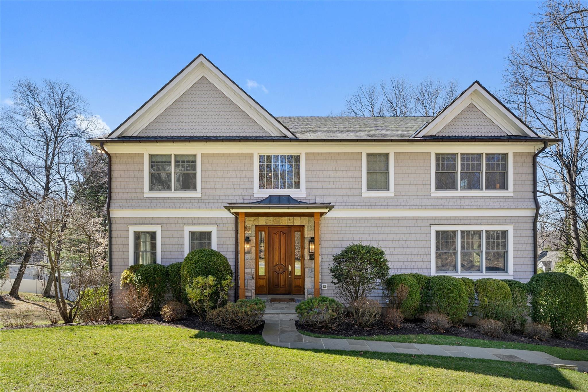 14 Flintlock Lane Ardsley, NY 10502 - Photo 1 of 36 a front view of a house with a yard