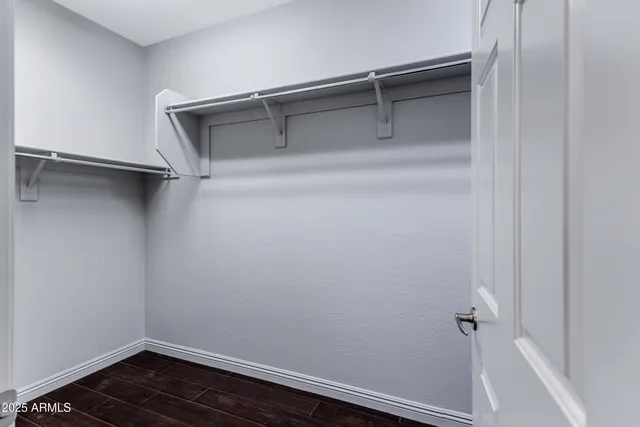 a view of an empty walk in closet