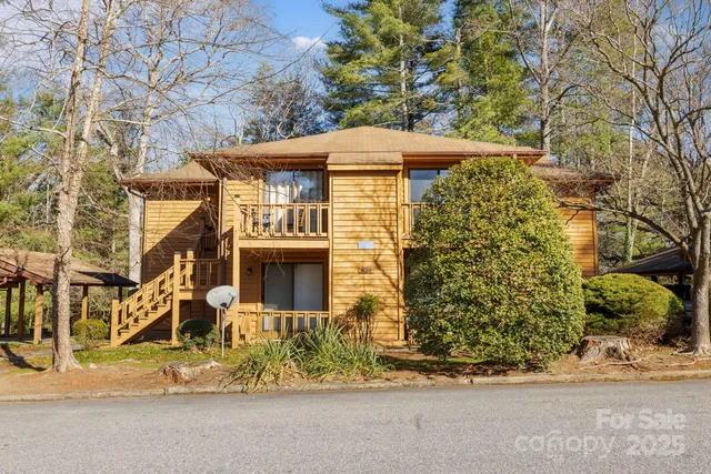 front view of a house with a tree