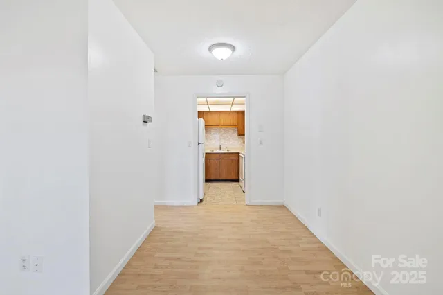 a kitchen with stainless steel appliances a sink stove and refrigerator