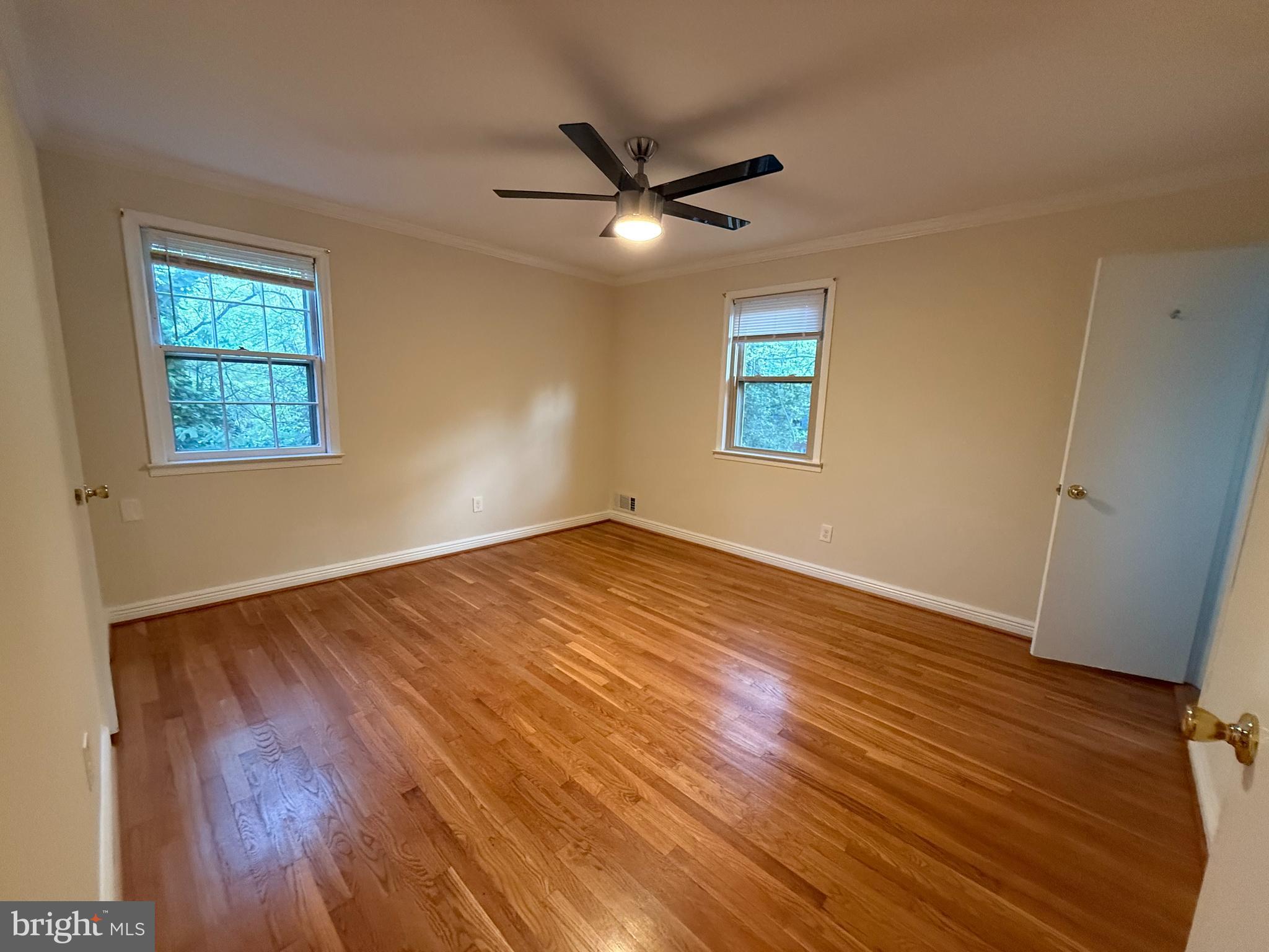 6209 Redwing Road Bethesda, MD 20817 - Photo 15 of 27 a view of empty room with wooden floor and fan