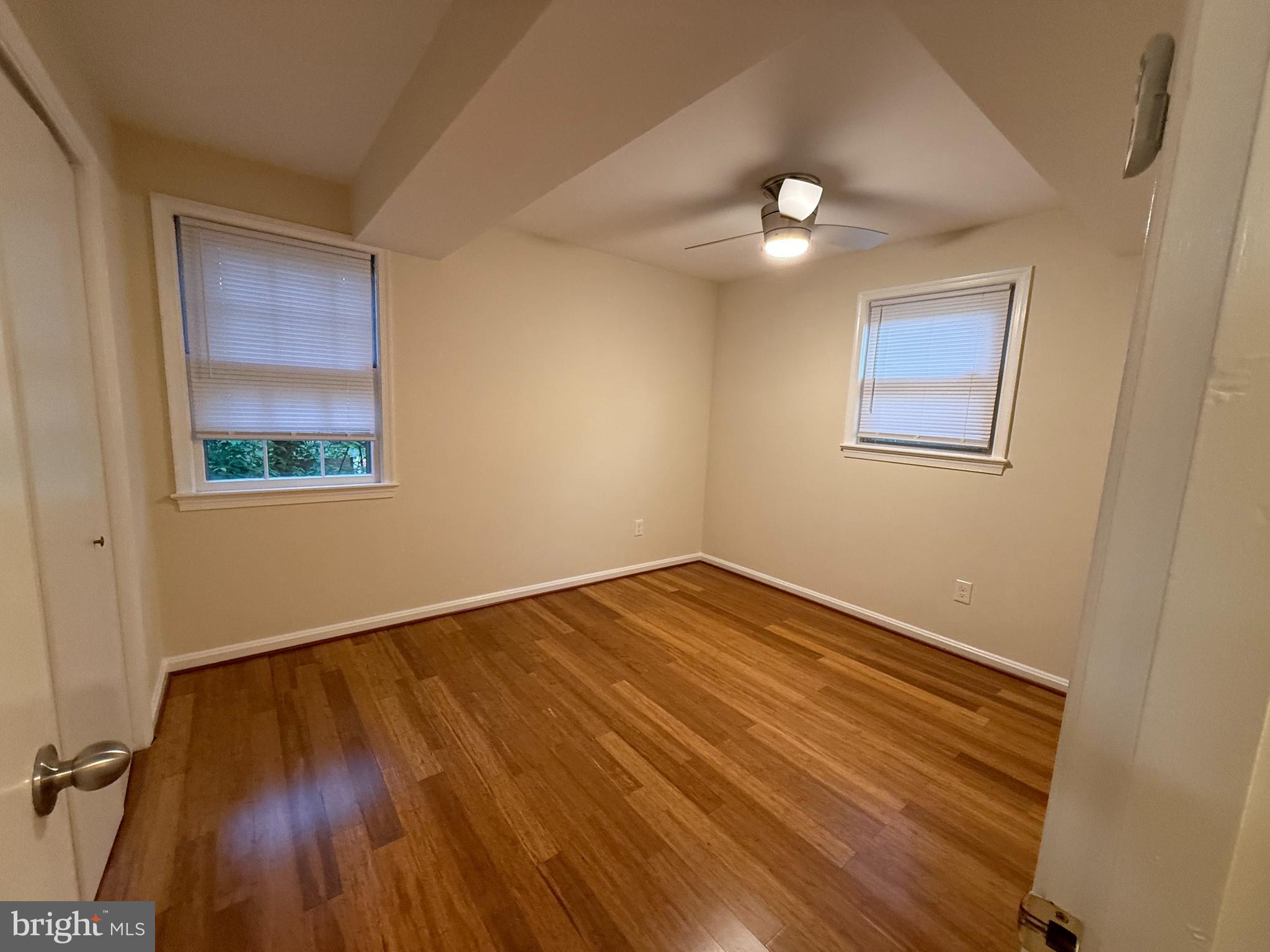 6209 Redwing Road Bethesda, MD 20817 - Photo 20 of 27 a view of an empty room with wooden floor and a window