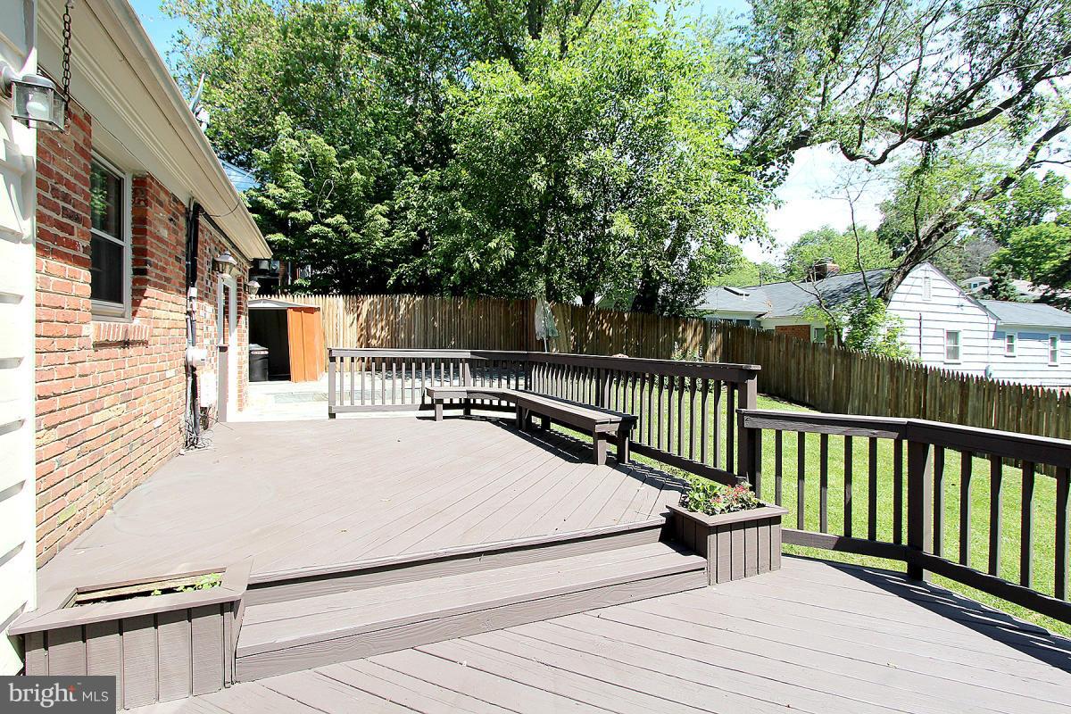 6209 Redwing Road Bethesda, MD 20817 - Photo 24 of 27 a view of balcony with wooden floor and fence