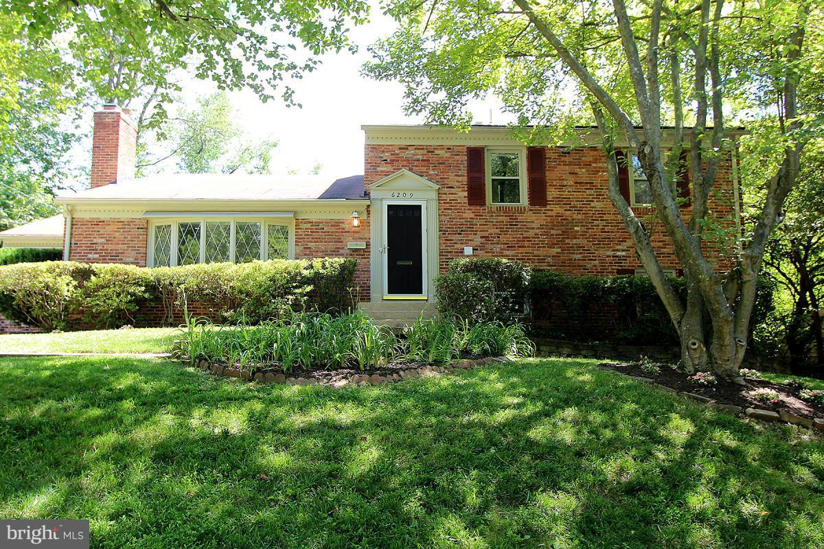 6209 Redwing Road Bethesda, MD 20817 - Photo 3 of 27 front view of a house with a yard
