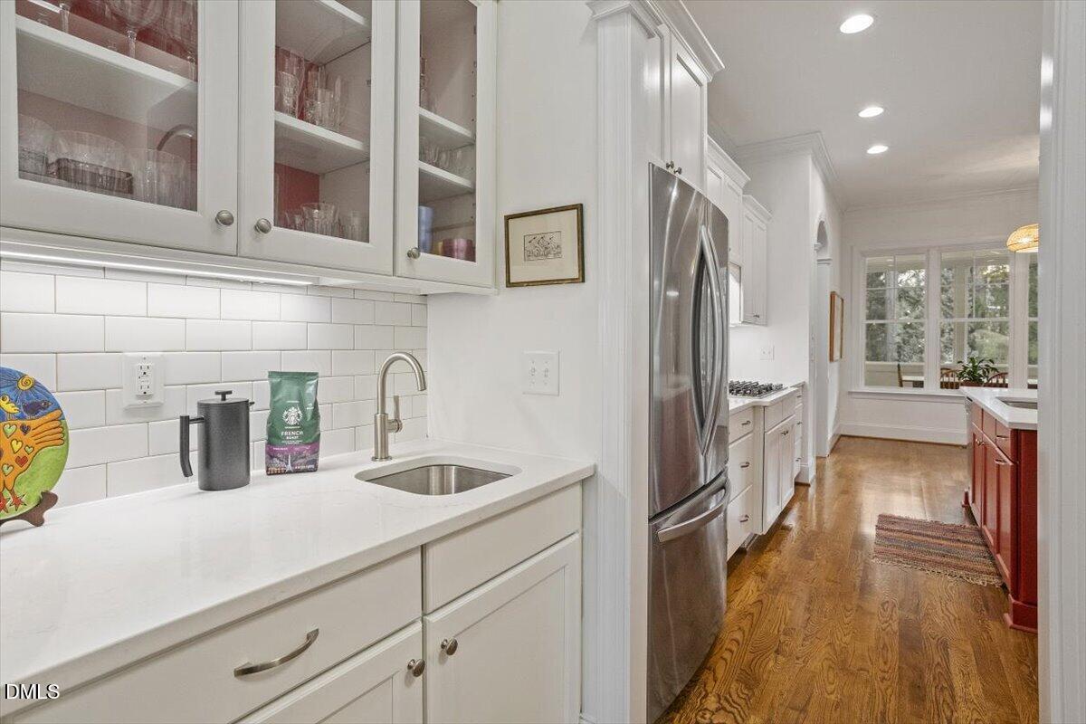 904 Prairie Smoke Street Wake Forest, NC 27587 - Photo 17 of 61 a kitchen with stainless steel appliances granite countertop a refrigerator and a sink