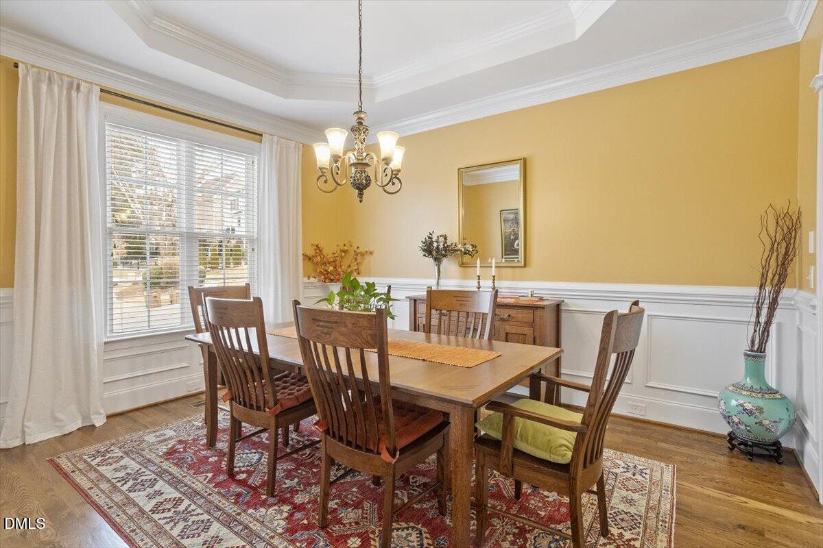 904 Prairie Smoke Street Wake Forest, NC 27587 - Photo 20 of 61 a view of a dining room with furniture window and wooden floor