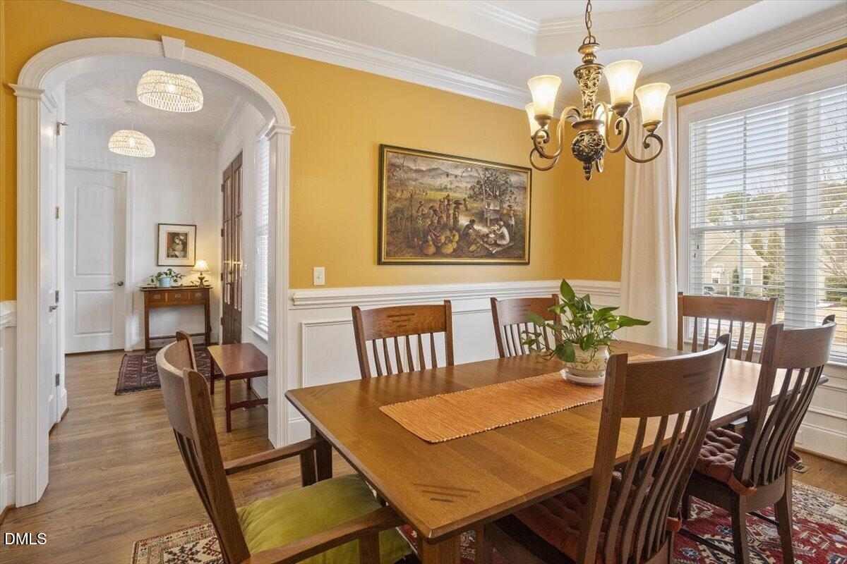 904 Prairie Smoke Street Wake Forest, NC 27587 - Photo 21 of 61 a view of a dining room with furniture window and wooden floor