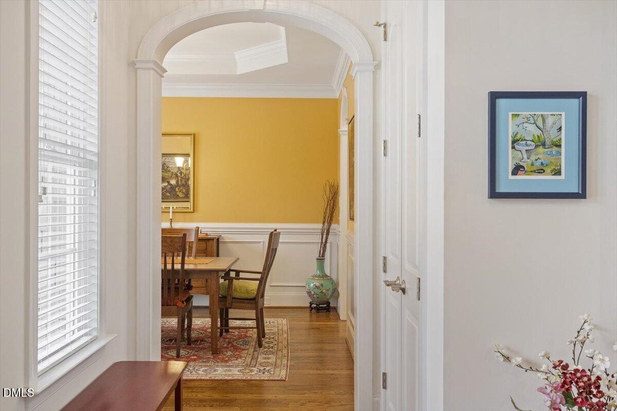 904 Prairie Smoke Street Wake Forest, NC 27587 - Photo 22 of 61 a view of a dining room with furniture and wooden floor