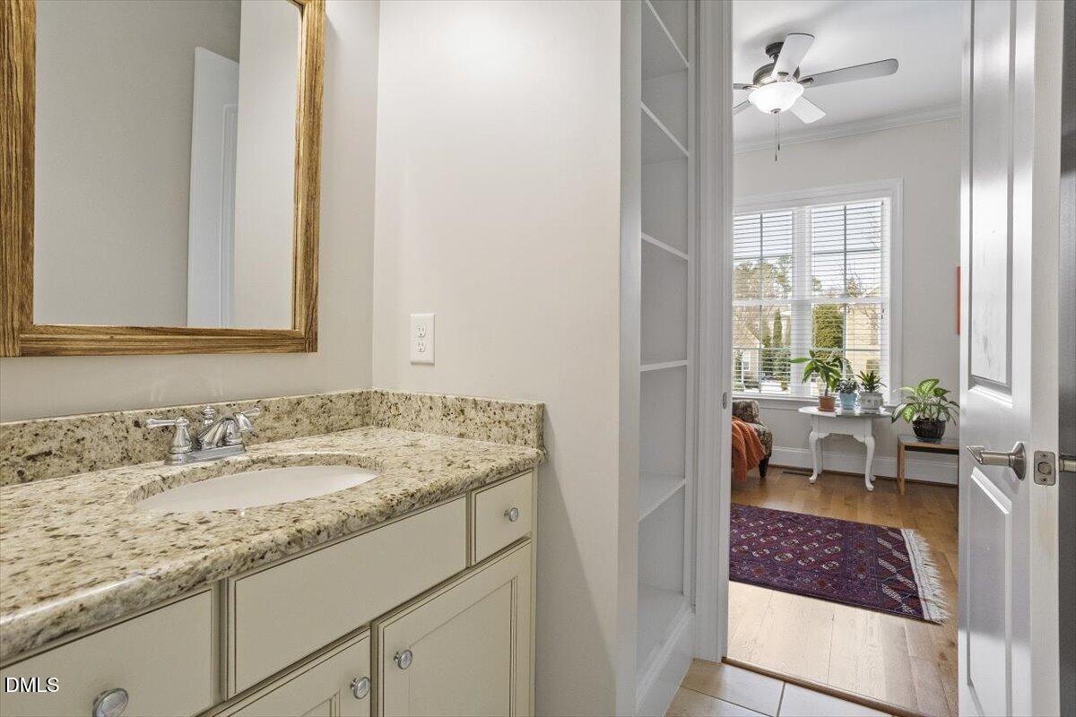 904 Prairie Smoke Street Wake Forest, NC 27587 - Photo 43 of 61 a bathroom with a sink a toilet and a mirror