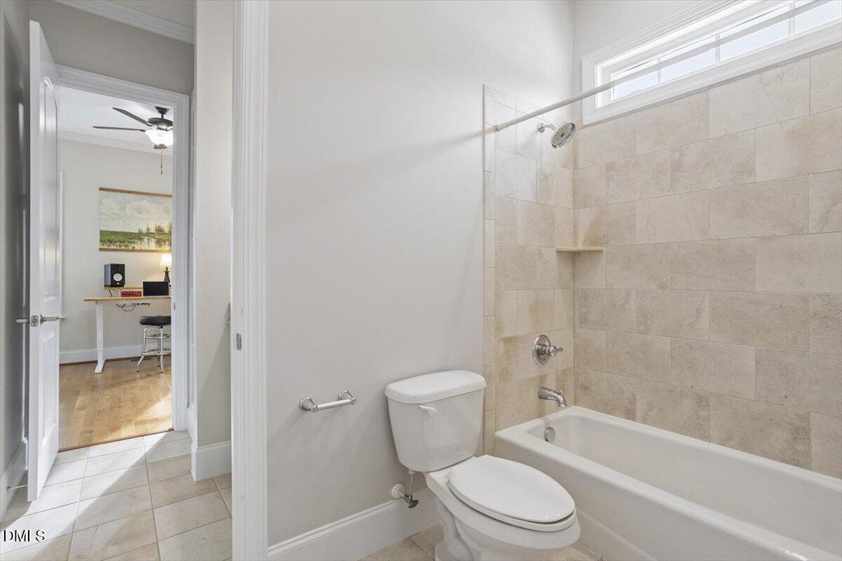 904 Prairie Smoke Street Wake Forest, NC 27587 - Photo 47 of 61 a bathroom with a toilet and a bath tub