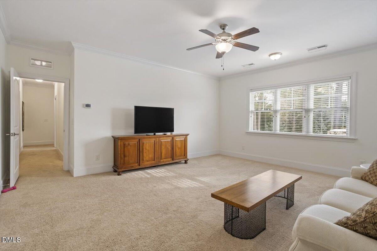 904 Prairie Smoke Street Wake Forest, NC 27587 - Photo 52 of 61 a living room with furniture and windows
