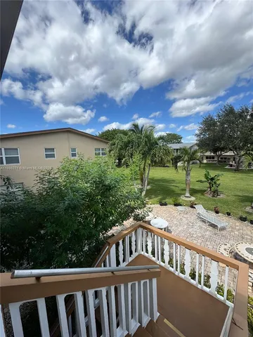 a view of a two chairs on the roof deck