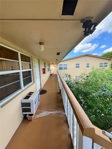 a balcony with wooden floor