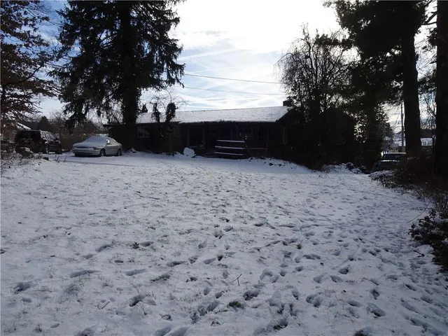 a view of balcony with wooden fence