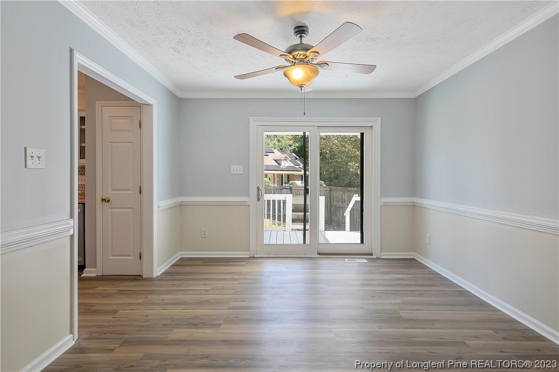 624 Porter Road Hope Mills, NC 28348 - Photo 11 of 45 a view of an empty room with wooden floor and a window