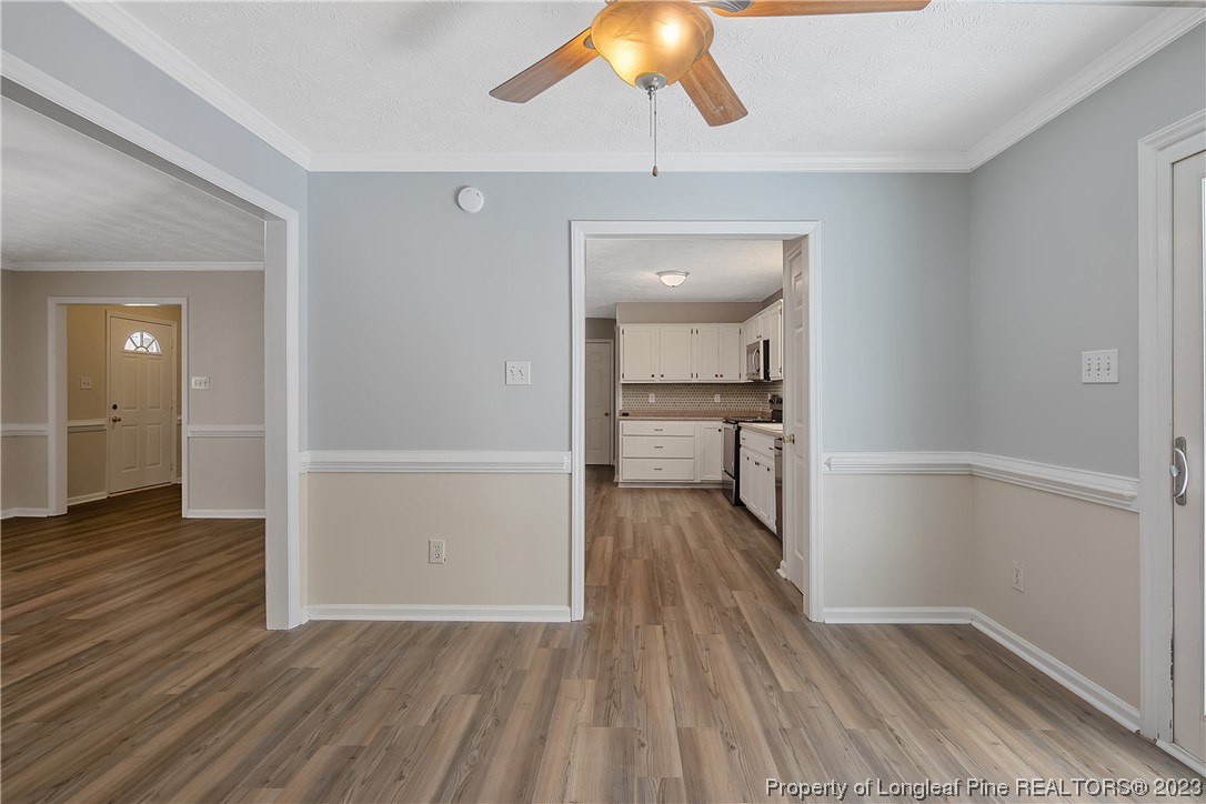 624 Porter Road Hope Mills, NC 28348 - Photo 12 of 45 wooden floor in an empty room with a window