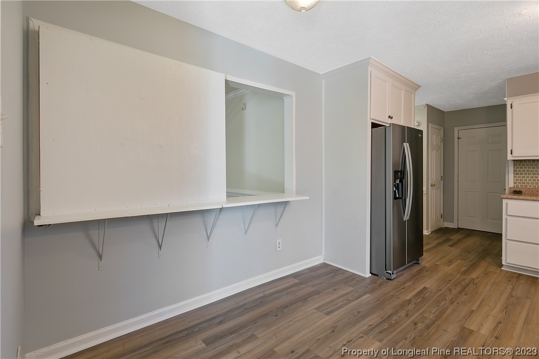 624 Porter Road Hope Mills, NC 28348 - Photo 14 of 45 a view of walk in closet with wooden floor