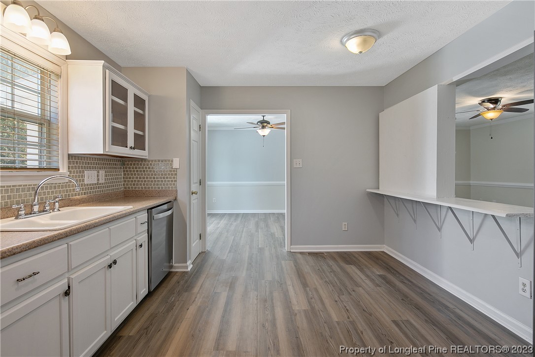624 Porter Road Hope Mills, NC 28348 - Photo 18 of 45 a view of a kitchen with wooden floor and electronic appliances