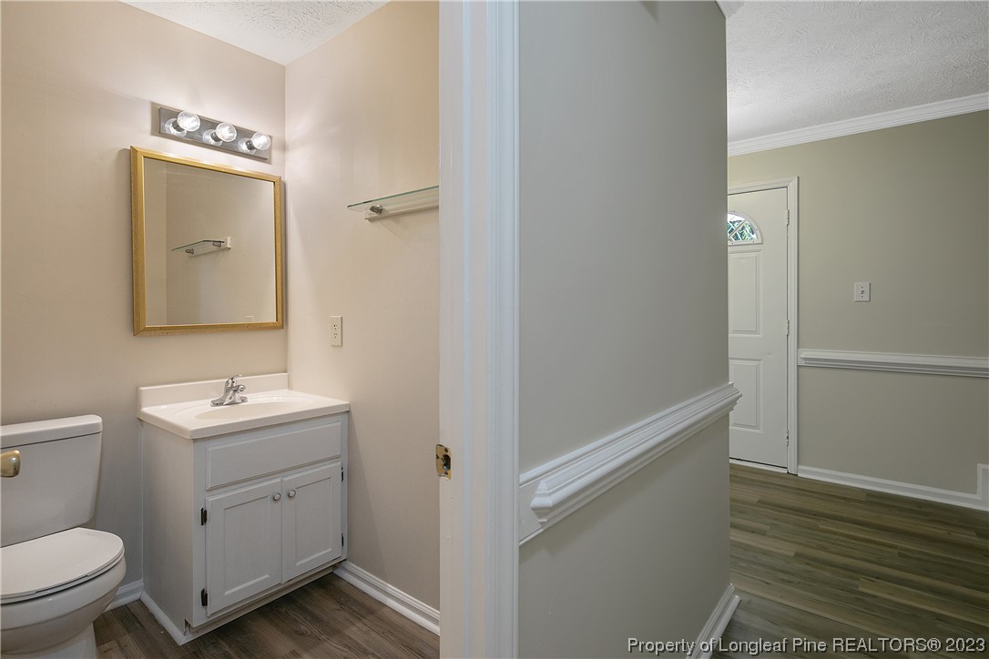 624 Porter Road Hope Mills, NC 28348 - Photo 21 of 45 a bathroom with a sink toilet and mirror