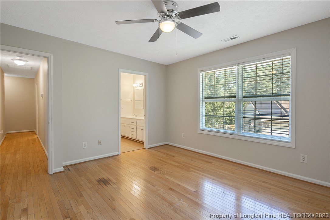 624 Porter Road Hope Mills, NC 28348 - Photo 25 of 45 a view of an empty room with window and wooden floor