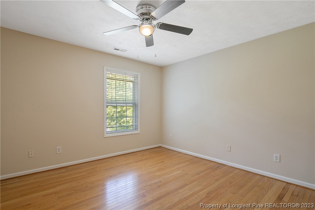 624 Porter Road Hope Mills, NC 28348 - Photo 30 of 45 wooden floor in an empty room with a window
