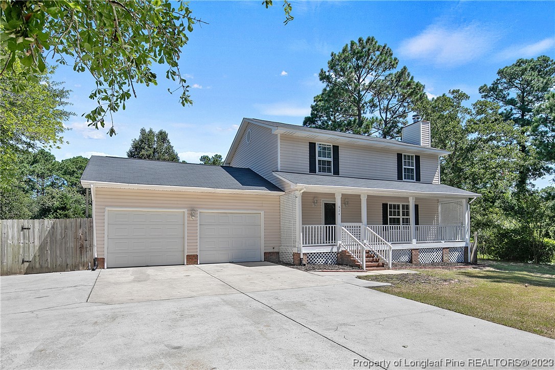 624 Porter Road Hope Mills, NC 28348 - Photo 3 of 45 a front view of a house with a yard and garage