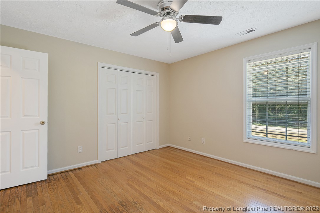 624 Porter Road Hope Mills, NC 28348 - Photo 33 of 45 a view of an empty room with wooden floor and a window