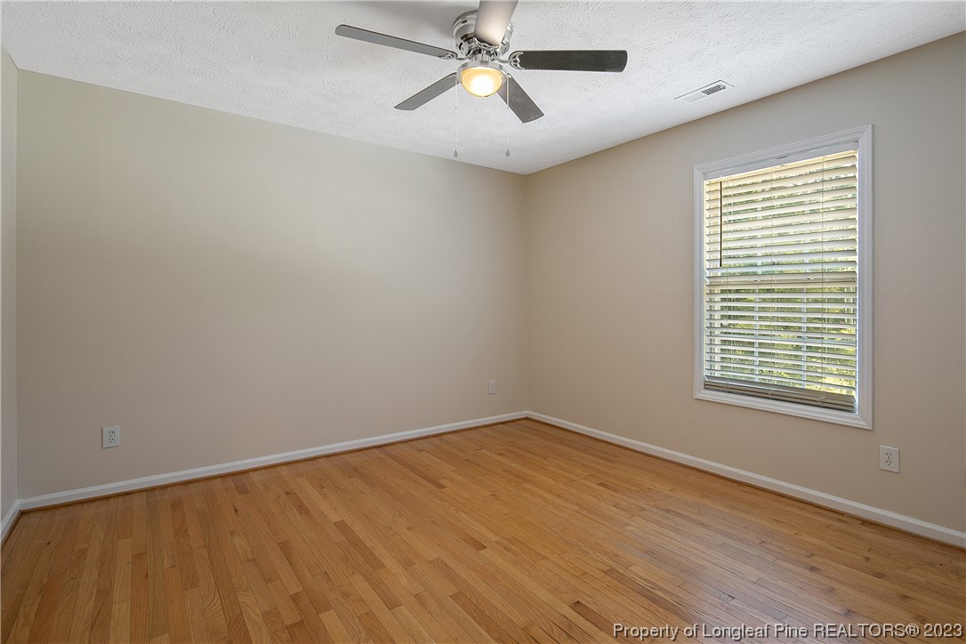 624 Porter Road Hope Mills, NC 28348 - Photo 37 of 45 a view of an empty room with window and chandelier fan